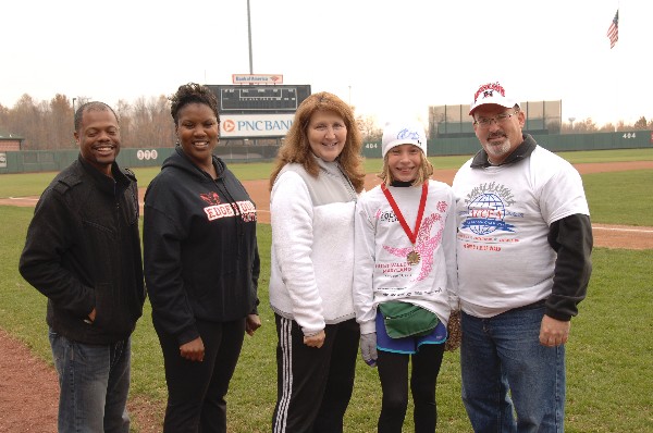 Chapter members gather to recognize one winner of the 5K Run & 1 Mile Walk in November.